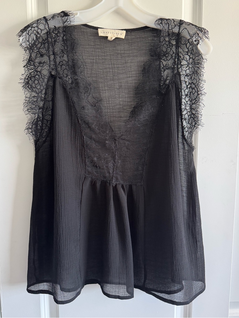 Lovestitch Black Lace Cap Sleeve Blouse in a sheer, romantic fabric